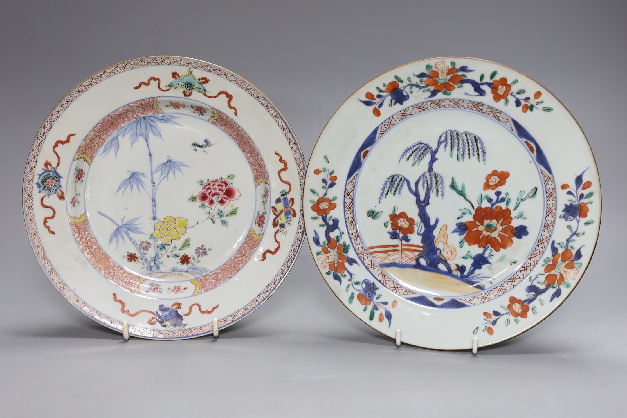 An 18th century Chinese export famille rose plate, similar saucer and an 18th century Chinese vert Imari plate, largest 22.5cm